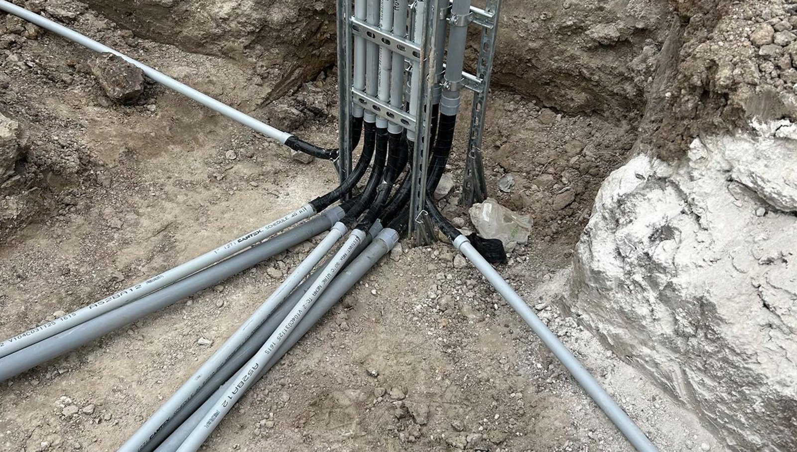trench with conduit pipes ready for backfill Houston