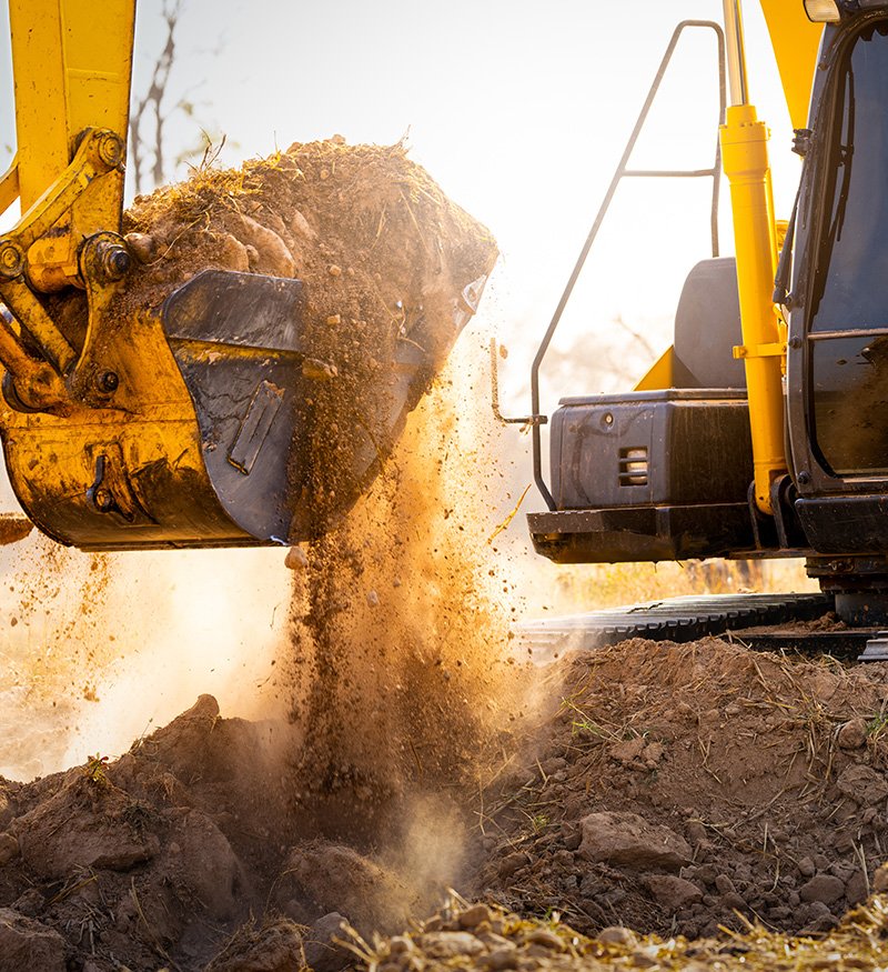 excavator bucket lifting soil at Houston trench site excavator bucket lifting soil at Houston trench site